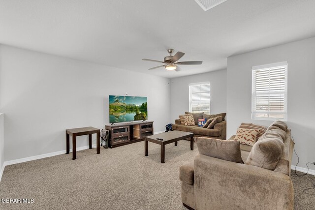 13868 Sky Ranger Ave, El Paso, TX 79928 - carpeted living room featuring a ceiling fan and baseboards