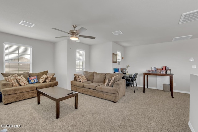 13868 Sky Ranger Ave, El Paso, TX 79928 - living room with light carpet, plenty of natural light, ceiling fan, and baseboards