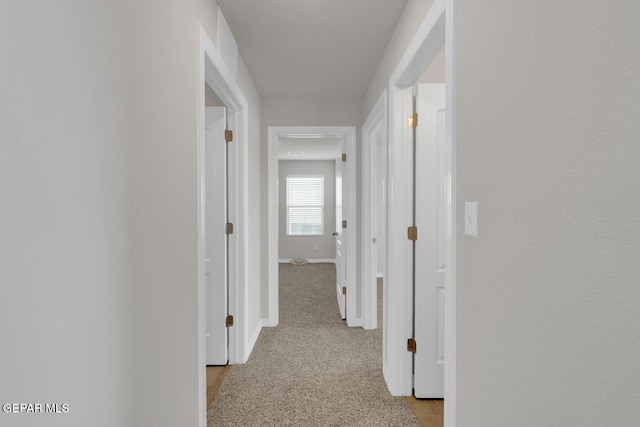 13868 Sky Ranger Ave, El Paso, TX 79928 - hall featuring baseboards and light carpet