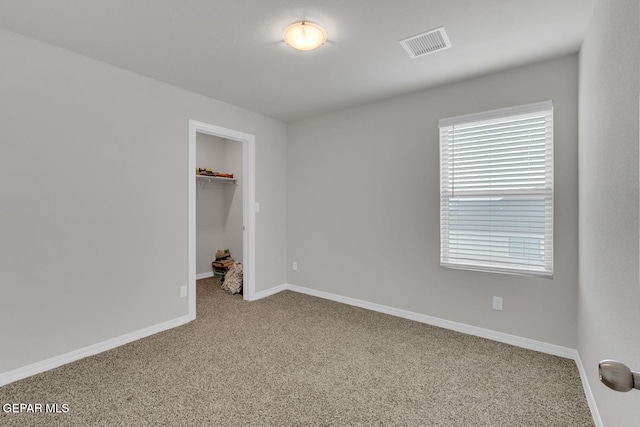 13868 Sky Ranger Ave, El Paso, TX 79928 - unfurnished bedroom with carpet flooring, a walk in closet, baseboards, and a closet