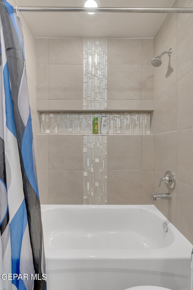 13868 Sky Ranger Ave, El Paso, TX 79928 - bathroom with shower / bathtub combination with curtain
