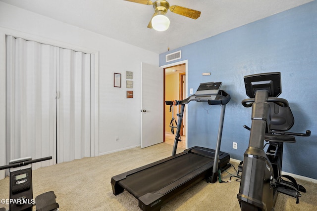 workout area with carpet flooring, baseboards, and ceiling fan