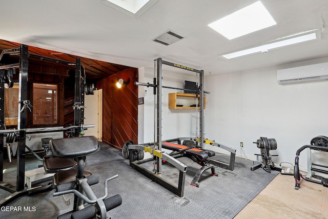 exercise area with a wall mounted air conditioner, carpet, and wood walls