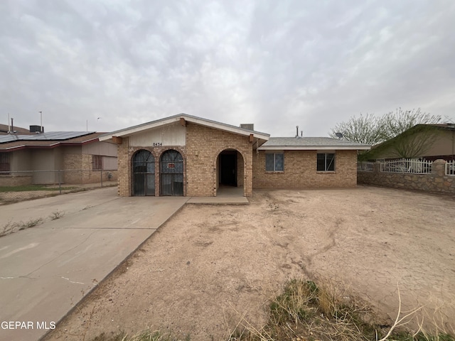 8434 Villanova Dr, El Paso, TX 79907 - ranch-style home with fence private yard, an attached garage, brick siding, and driveway