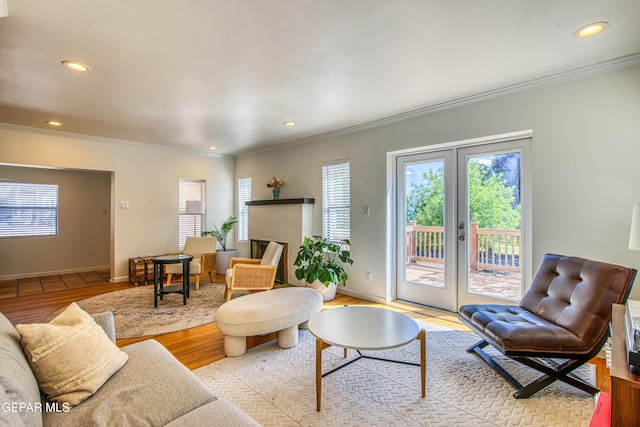 living room featuring french doors, crown molding, wood finished floors, recessed lighting, and baseboards