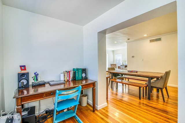 office area with wood finished floors, baseboards, recessed lighting, and crown molding