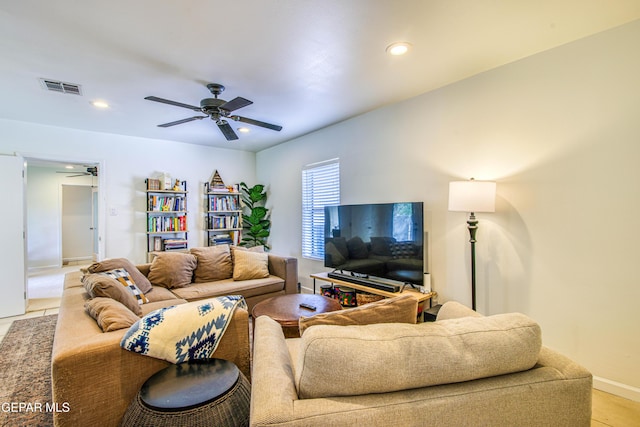 living room with ceiling fan, recessed lighting, and baseboards