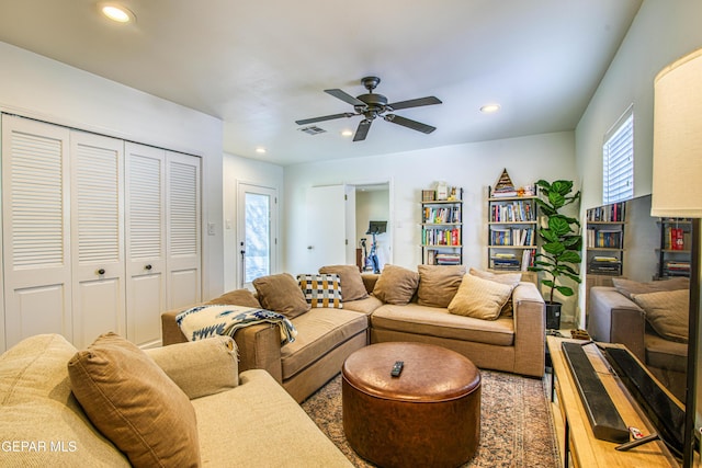 living room with recessed lighting and a ceiling fan