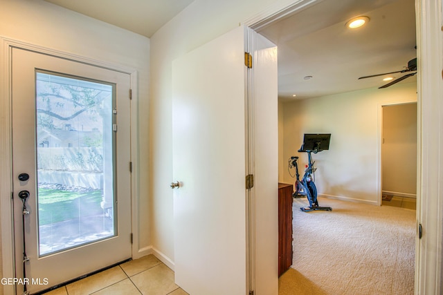 entryway featuring ceiling fan, baseboards, recessed lighting, light tile patterned floors, and light carpet