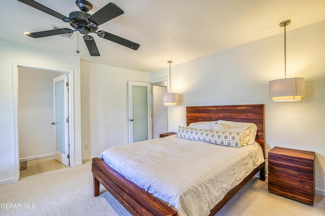 bedroom with carpet flooring, baseboards, and a ceiling fan