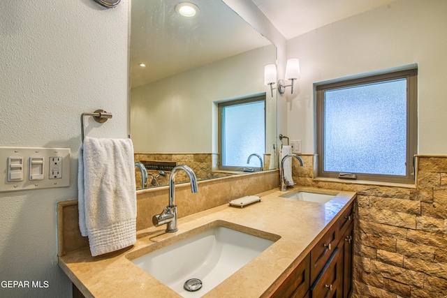 full bathroom featuring double vanity