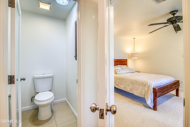 bedroom featuring baseboards, a ceiling fan, and tile patterned flooring