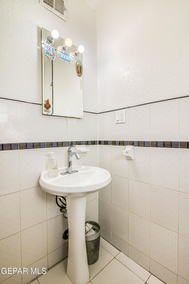 bathroom featuring tile walls and tile patterned flooring