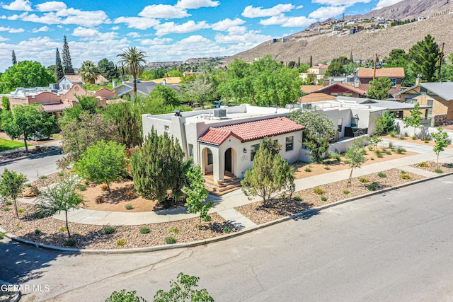 aerial perspective of suburban area featuring a mountainous background