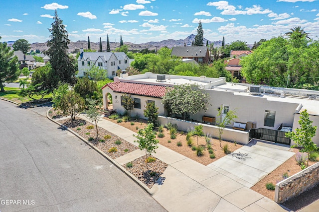 aerial view of residential area with mountains