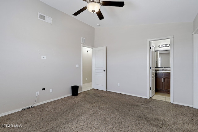 14182 John Scagno, El Paso, TX 79938 - unfurnished bedroom featuring light colored carpet, lofted ceiling, and visible vents