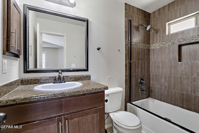 14182 John Scagno, El Paso, TX 79938 - full bathroom featuring toilet, bathing tub / shower combination, vanity, and a textured wall