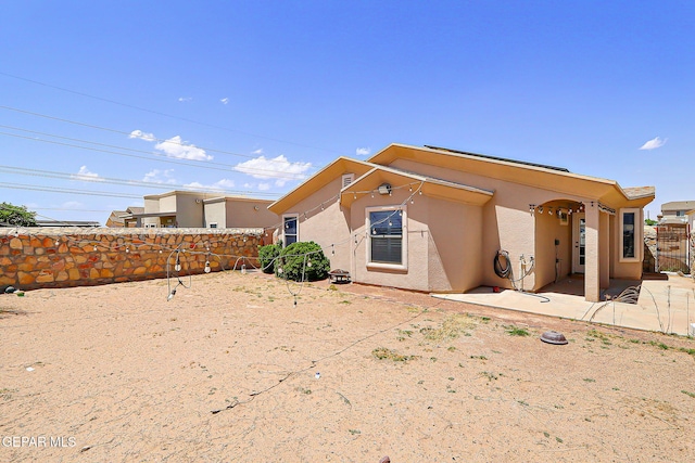14182 John Scagno, El Paso, TX 79938 - back of house with stucco siding and a fenced backyard