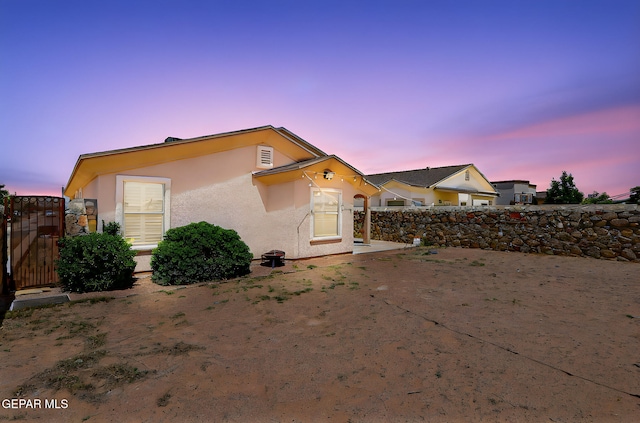 14182 John Scagno, El Paso, TX 79938 - view of front of home with stucco siding, a gate, and fence