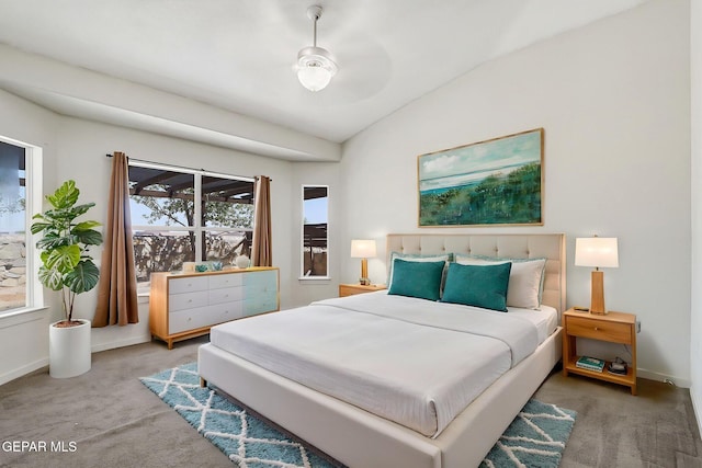 bedroom with carpet flooring, baseboards, and lofted ceiling