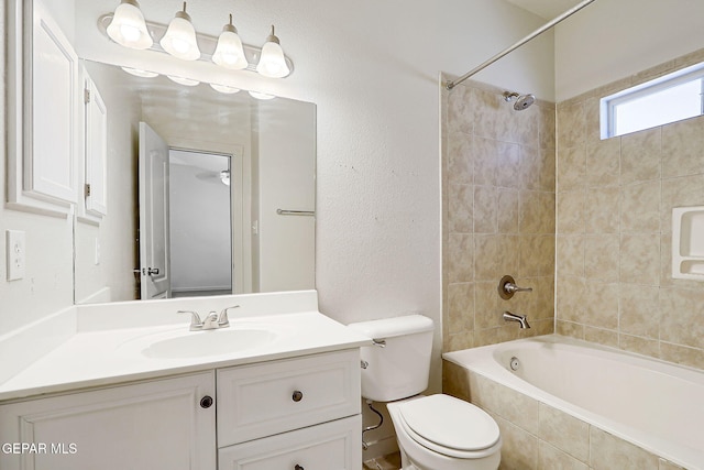 bathroom featuring vanity, toilet, and bathtub / shower combination