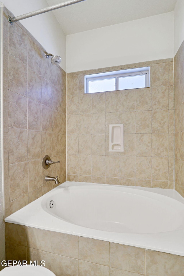 full bath featuring tub / shower combination