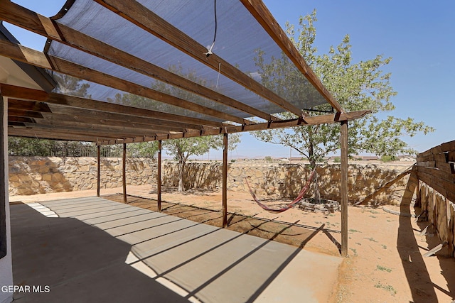 view of patio / terrace with a pergola and a fenced backyard