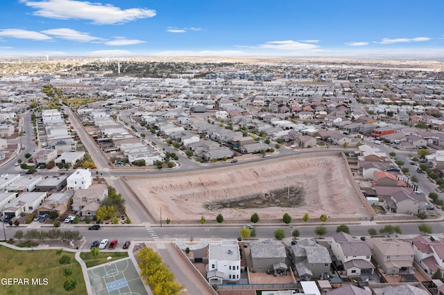aerial view of property and surrounding area with nearby suburban area
