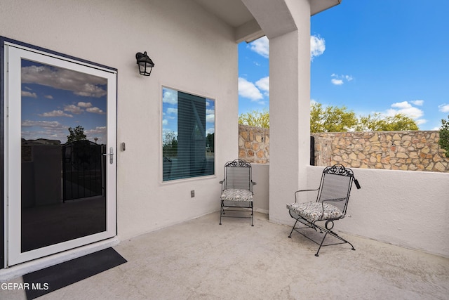 view of patio featuring fence