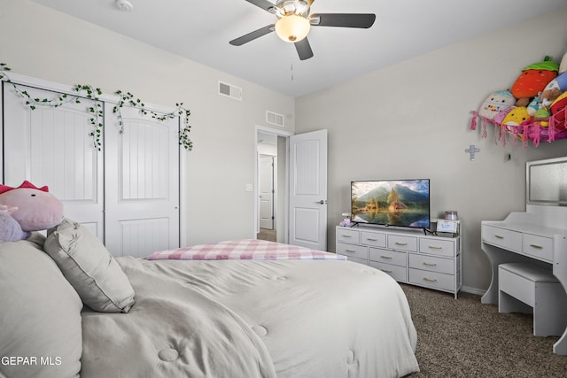 bedroom with dark colored carpet, a ceiling fan, a closet, and baseboards