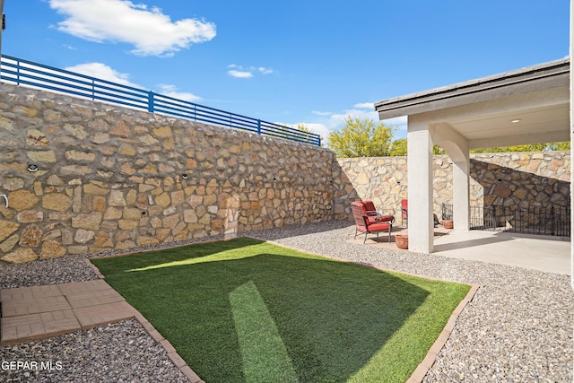 fenced backyard featuring a patio