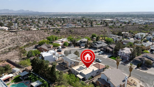aerial view of residential area with a mountainous background