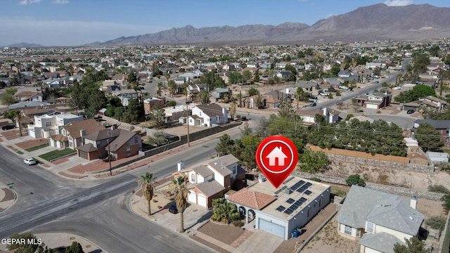 drone / aerial view featuring a mountain view and a residential view