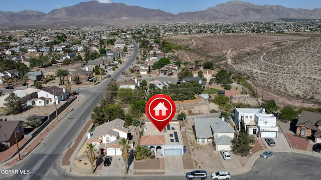 aerial view featuring a mountain view and a residential view