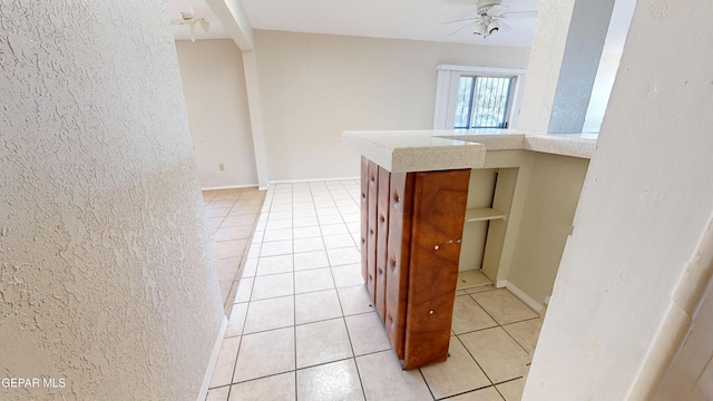 hall with light tile patterned floors