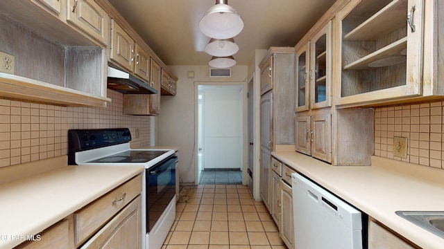 kitchen with electric range, under cabinet range hood, dishwasher, tasteful backsplash, and light tile patterned flooring