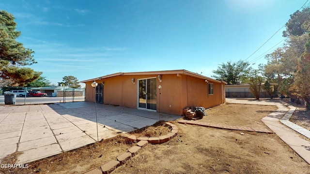 back of house featuring fence and a patio