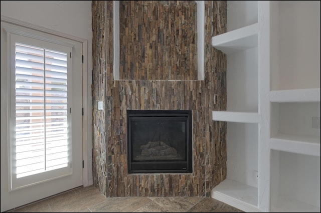 detailed view of a glass covered fireplace