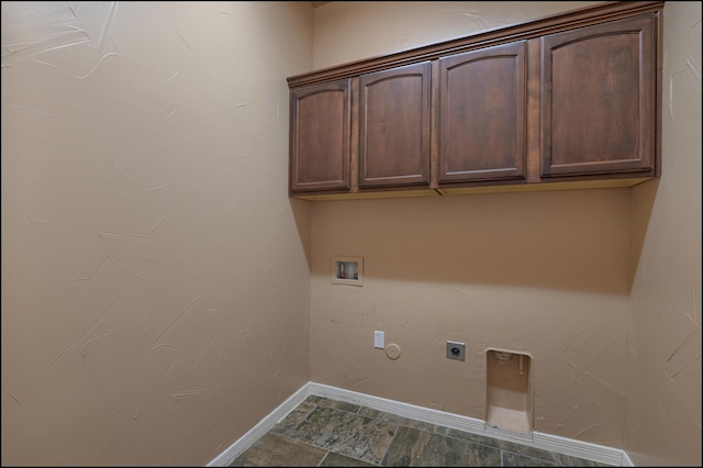 laundry area featuring hookup for an electric dryer, cabinet space, hookup for a washing machine, and baseboards
