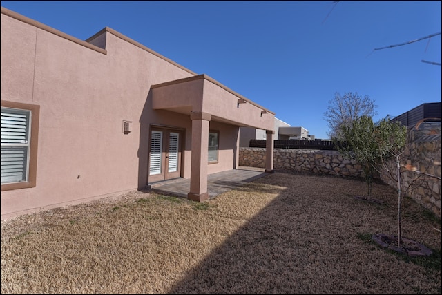 view of yard with a patio area and french doors