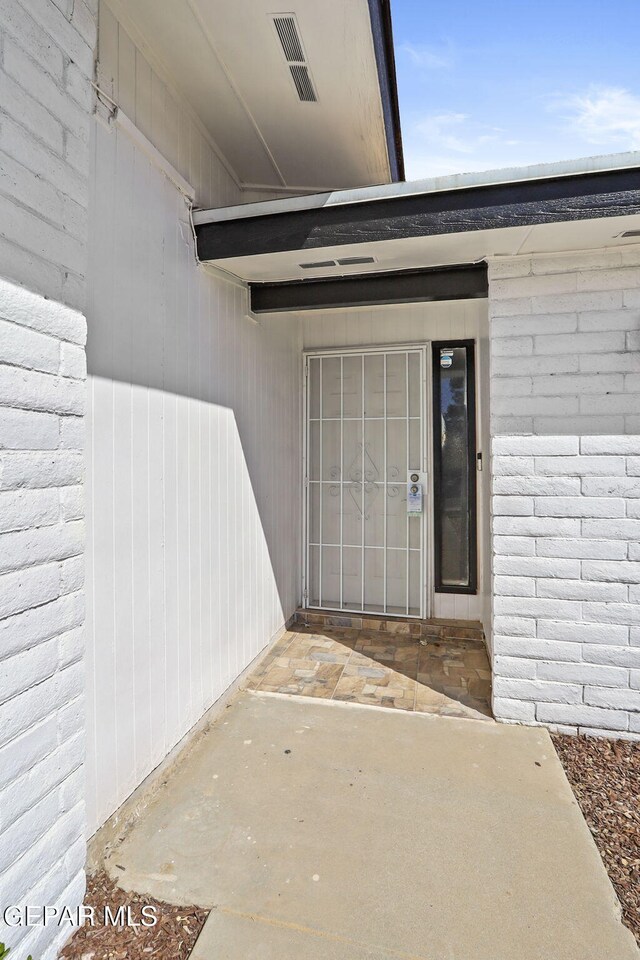 property entrance with a patio area