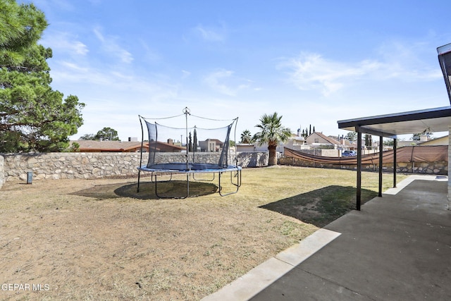 view of yard with a trampoline