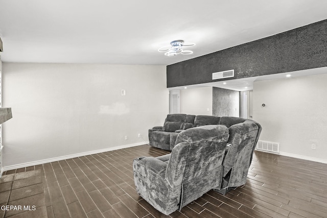 living area featuring dark wood finished floors and baseboards