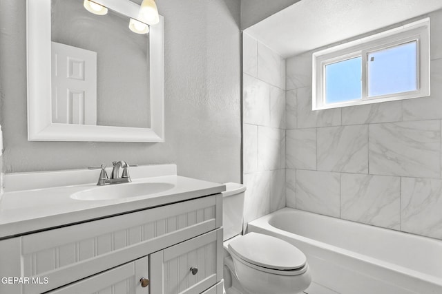 full bath featuring toilet, vanity, and shower / bathtub combination