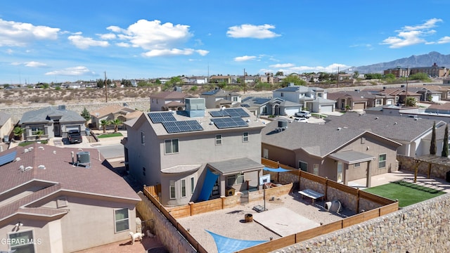 aerial view of residential area with a mountainous background