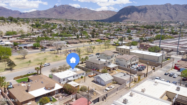 aerial view of residential area with a mountainous background