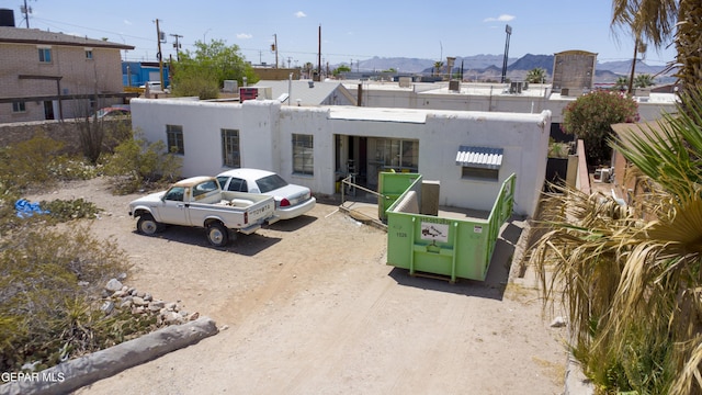 view of building exterior featuring a mountain view