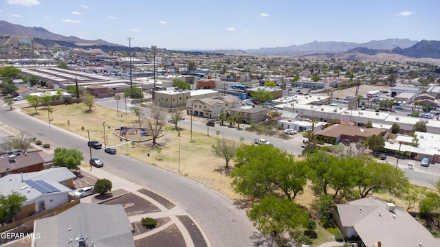 aerial view of residential area featuring mountains