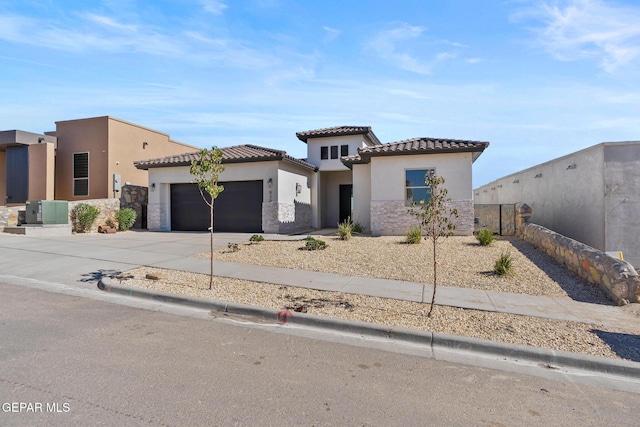 820 Acton St, Horizon City, TX 79928 - view of front facade with a garage, stucco siding, concrete driveway, and a tile roof