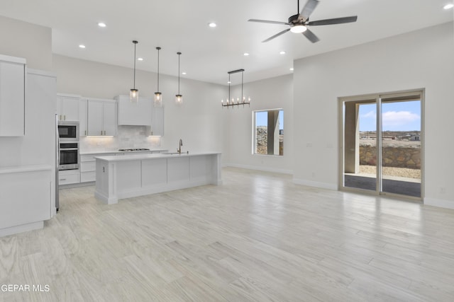 820 Acton St, Horizon City, TX 79928 - kitchen featuring stainless steel appliances, recessed lighting, light countertops, open floor plan, and baseboards